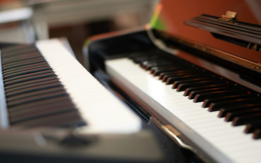 a close up of a black and white piano